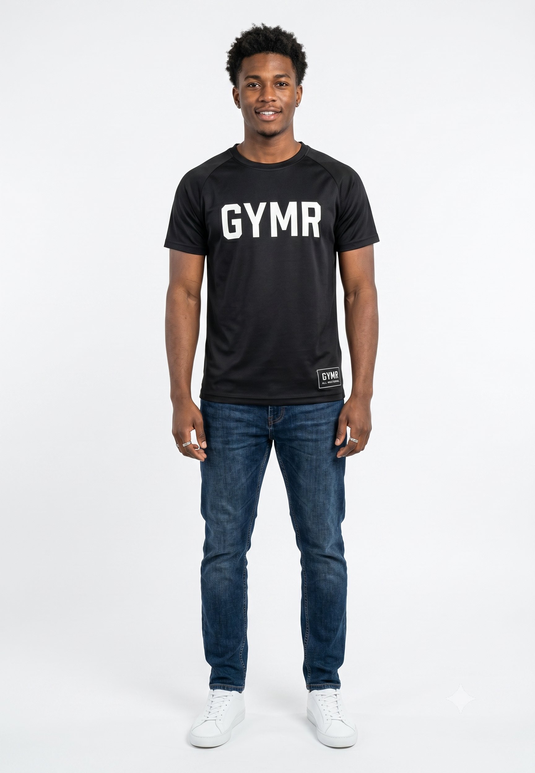 Person wearing a black 'GYMR' t-shirt and blue jeans on a white background