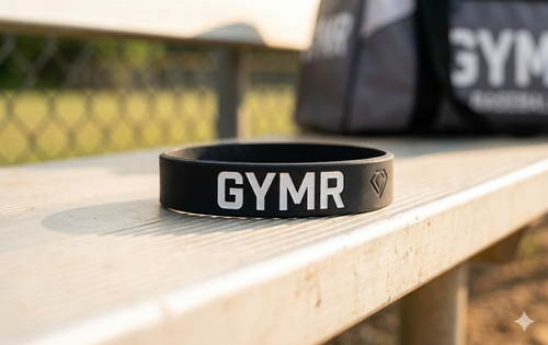 Black GYMR wristband on stone surface