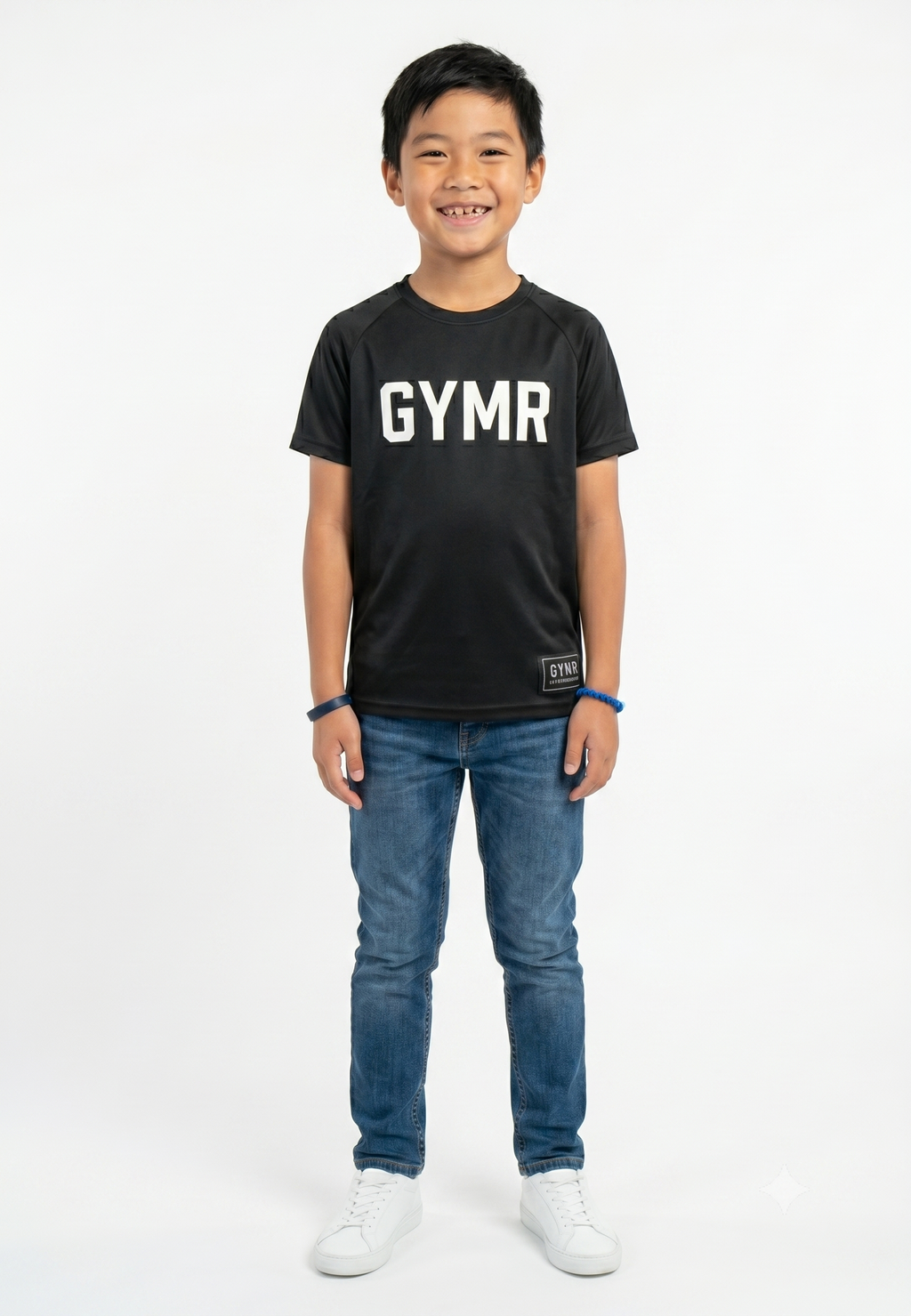 Child wearing a black 'GYMR' t-shirt and blue jeans on a white background