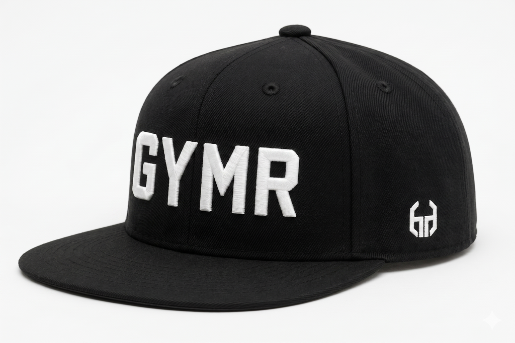 Side profile view of a structured black snapback hat showcasing a small white embroidered geometric brand logo on the panel, with a partial view of the front white GYMR lettering.