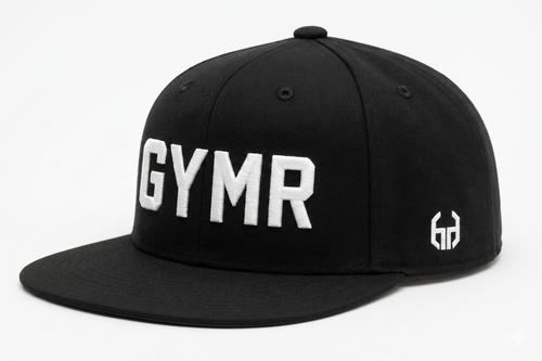 Side profile view of a structured black snapback hat showcasing a small white embroidered geometric brand logo on the panel, with a partial view of the front white GYMR lettering.